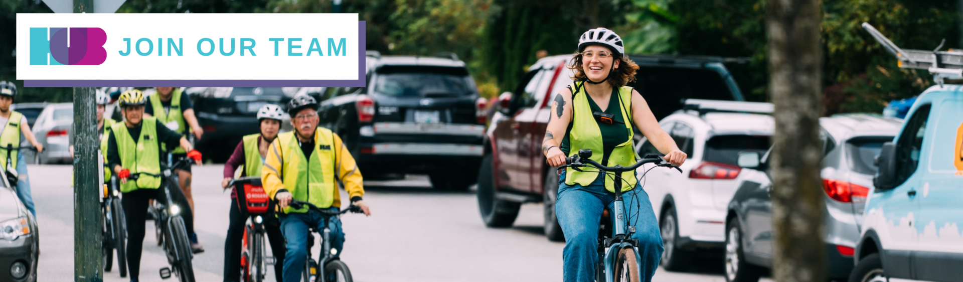 A bike education instructors leads several adult participants on a guided ride. Text overlayed on the image reads: "Join Our Team".