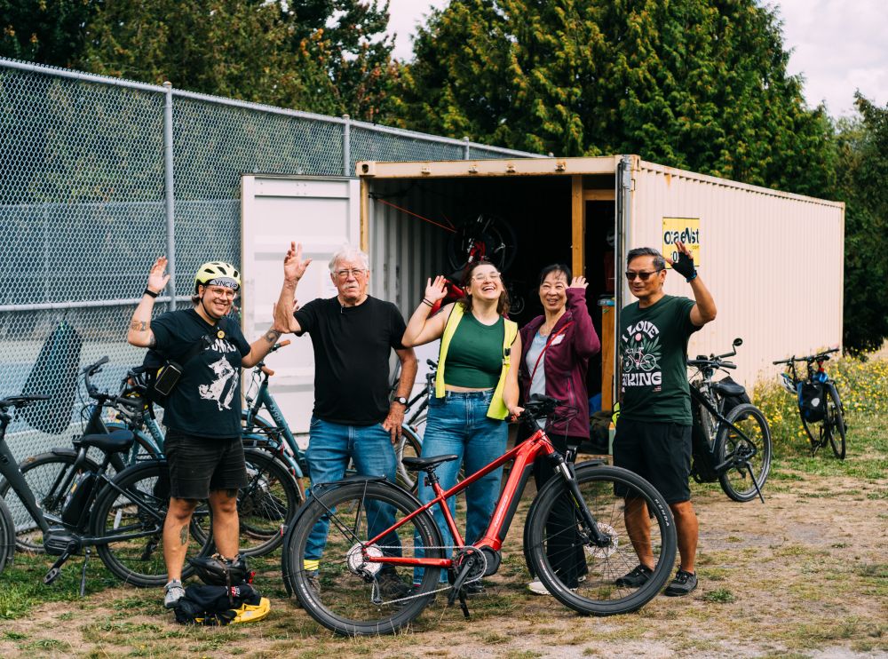 Five instructors wave at the camera.