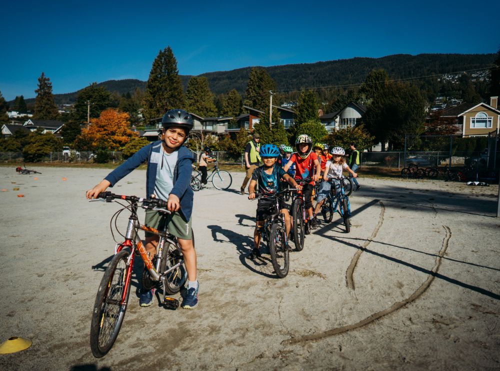 Students ride their bikes around the school grounds.