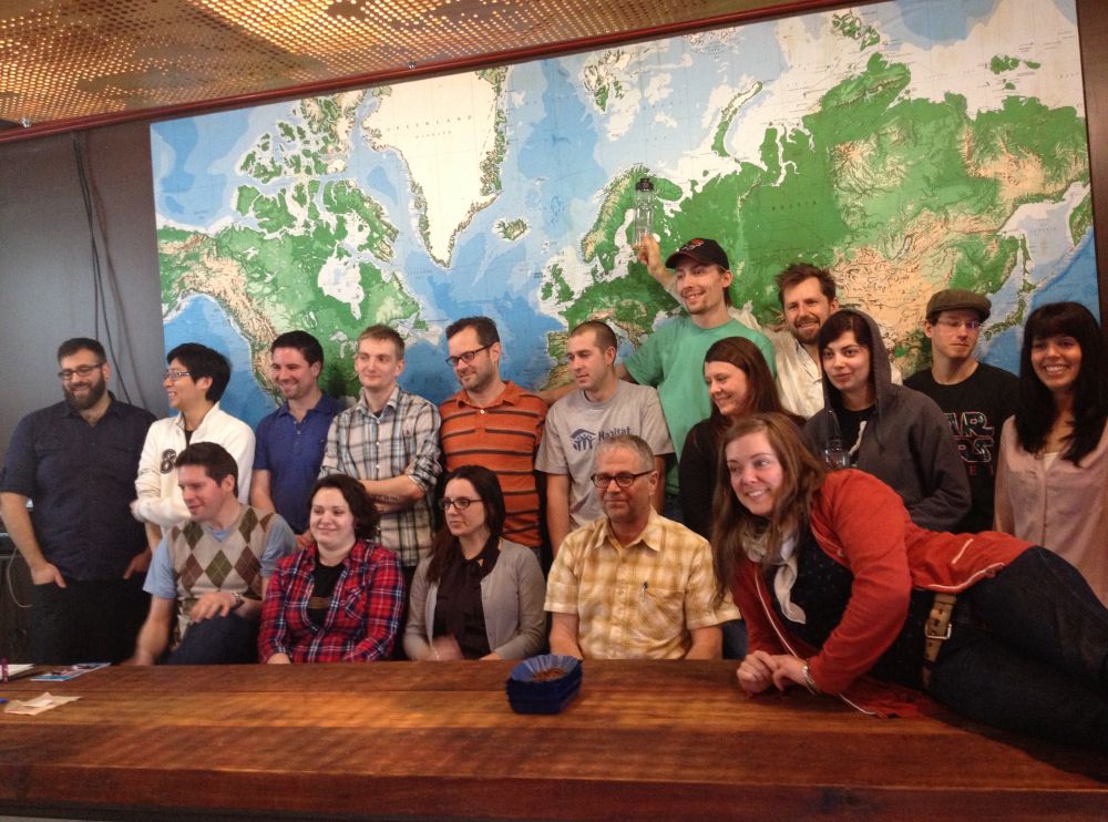 A group of employees pose for a group photo.