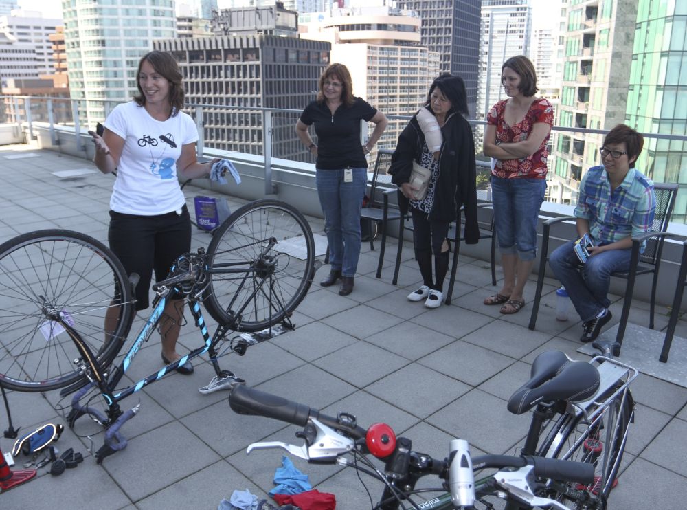 A woman presents a workshop to a group of adults.