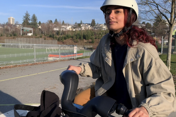 A woman rides an e-bike.