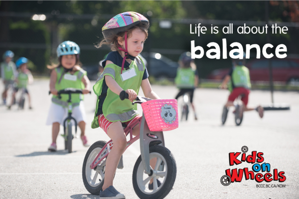 A girl rides a balance bike. Text reads: Life is all about balance.