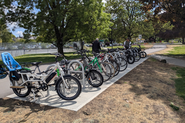 Several bikes parking at bike racks.