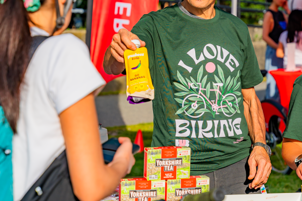 Event staff hand out free treats from event sponsors 
