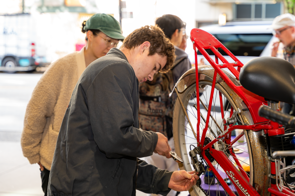 A mechanic checks a bike during Go By Bike Week