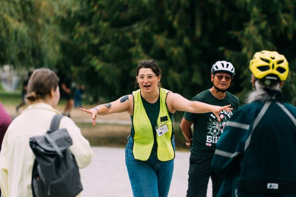 A bike education instructor speaks to a group of adult participants.