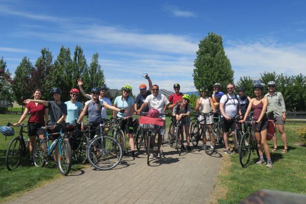 HUB Cycling staff pose for a photo with their bikes while on a social ride