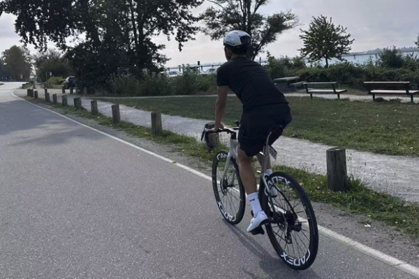 A photo of 17-year-old Bill Pai riding his bike.