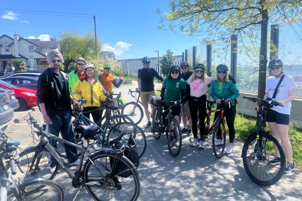 Several people pose for a photo with their bikes while on a social bike ride with the North Shore Local Committee.