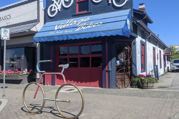 Bike shaped bike rack outside Village Bikes