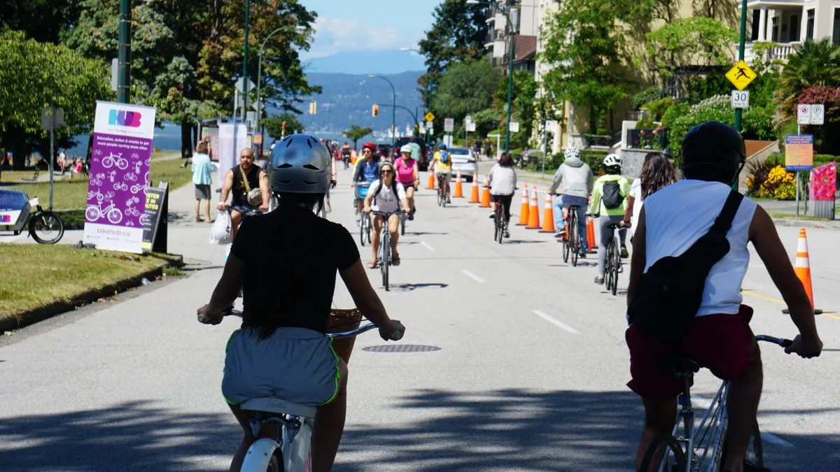 People ride bikes on Beach Ave in Vancouver.