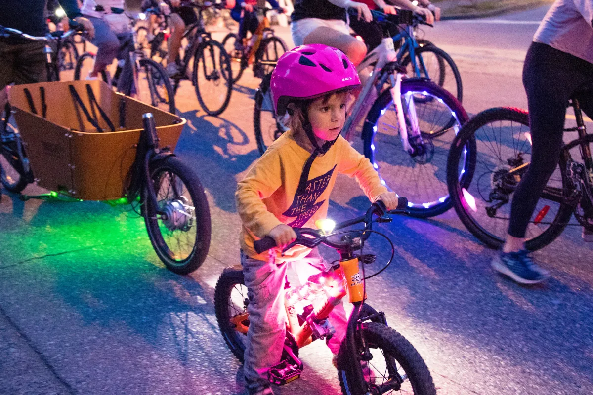 A girl rides her bike
