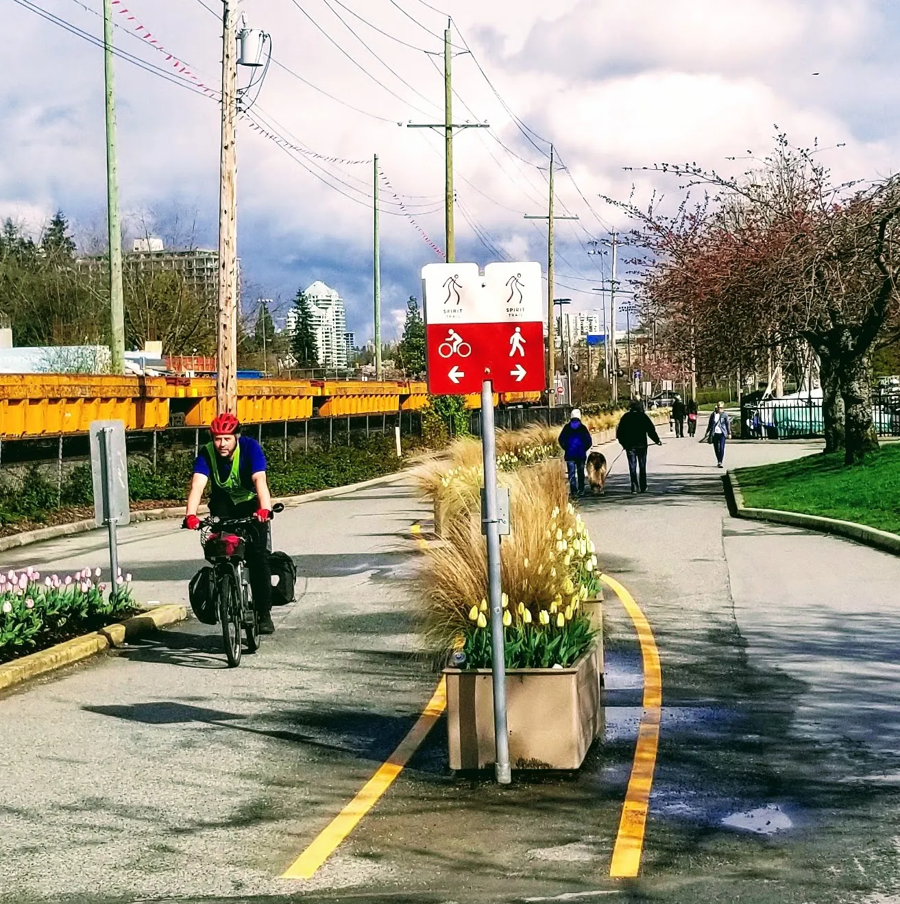 A person rides a bike on the Spirit Trail.
