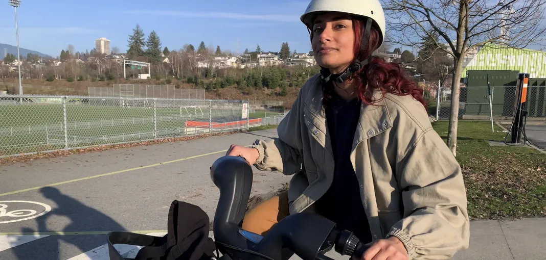 A woman rides an e-bike.