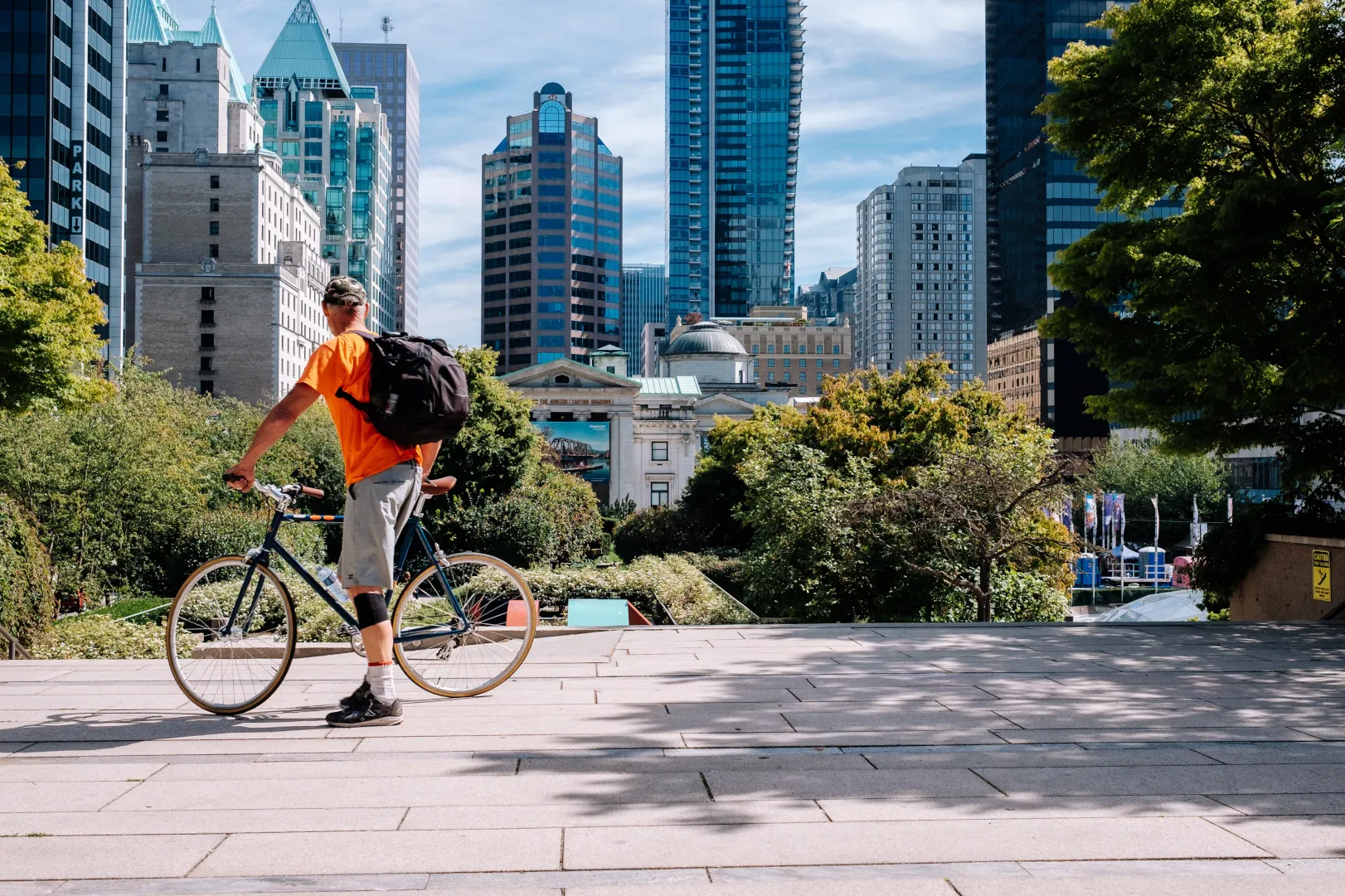 Urban cyclist in front of horizon of buildings
