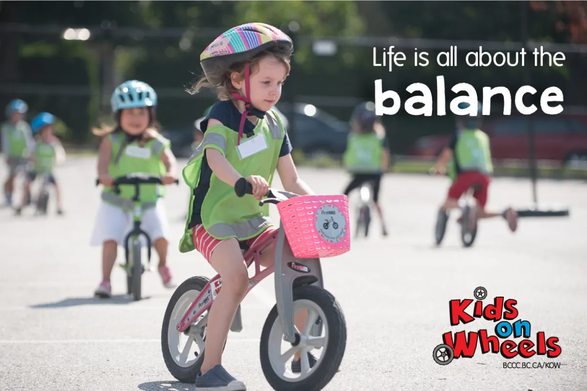A girl rides a balance bike. Text reads: Life is all about balance.