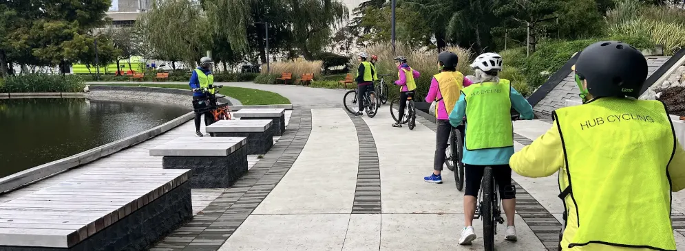 Several people ride on a multi-use path.