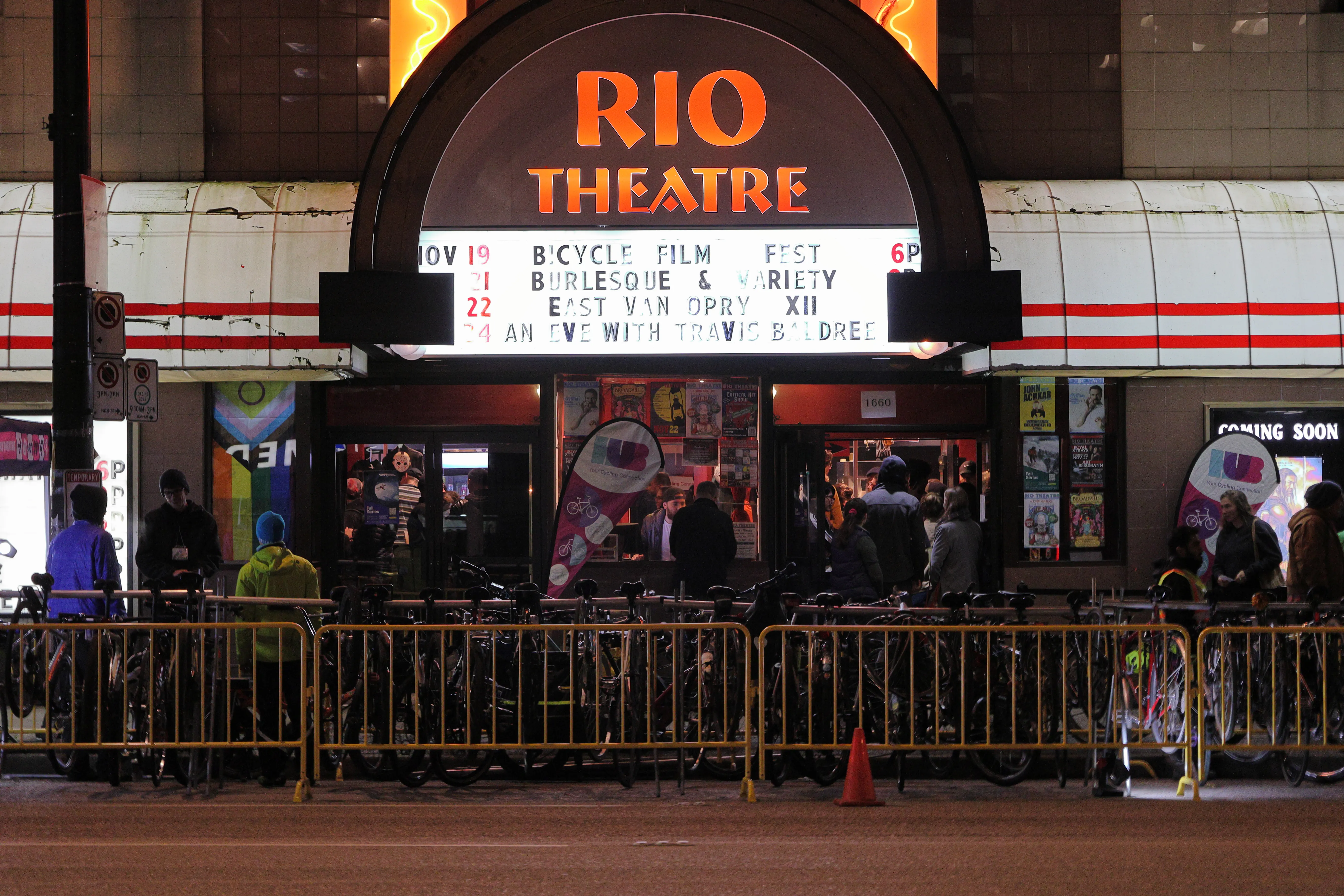 The facade of the Rio Theatre, where the Bicycle Film Festival was held. Several people are queuing in line.